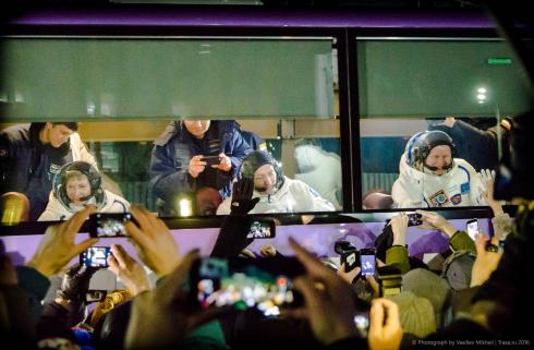 Cosmonauts in bus going to Launchpad with Soyuz spaceship