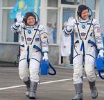 Cosmonauts Yurchihin and Fisher in space suite Sokol